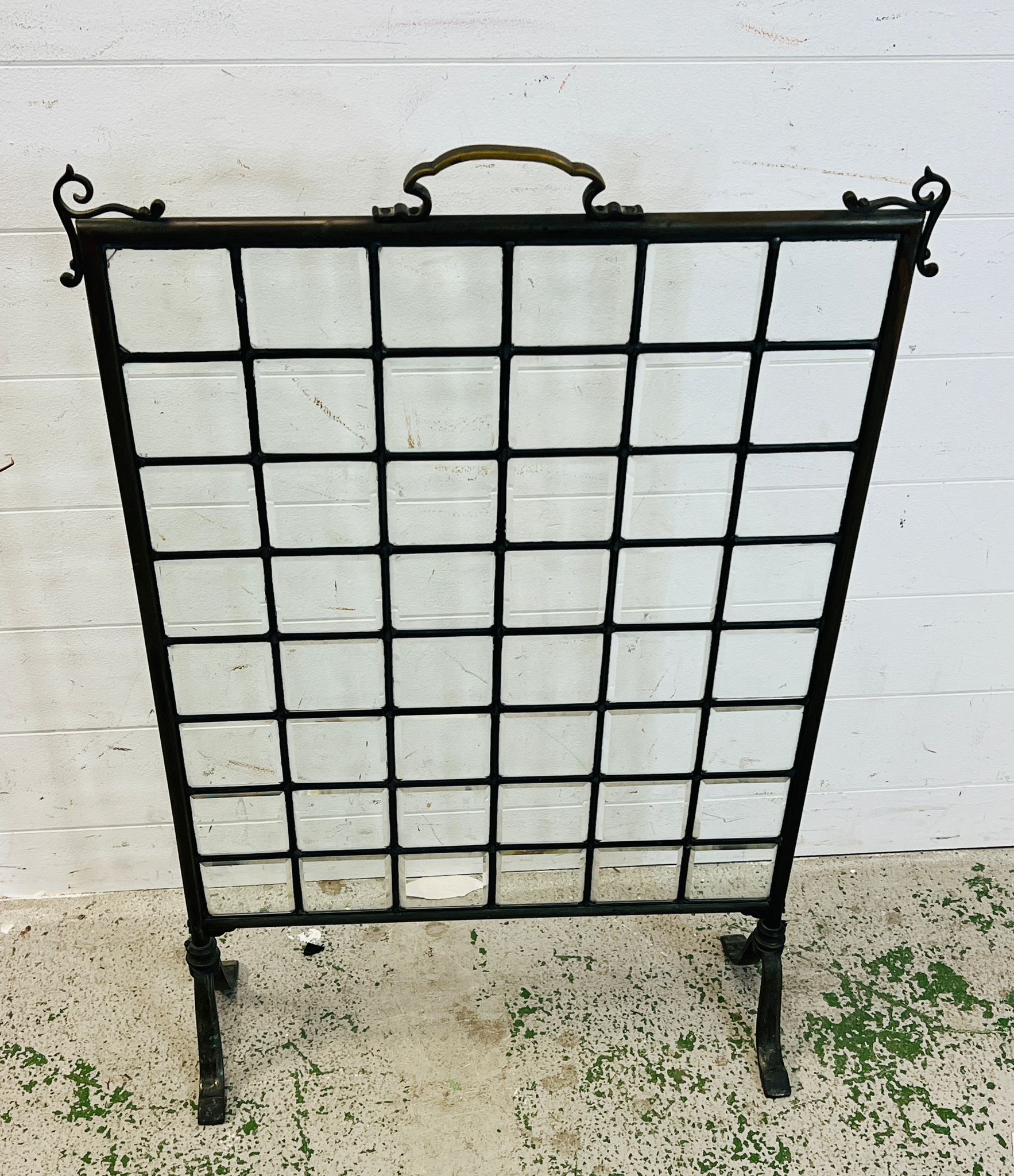 A glass panel fire screen 60cm x 84cm