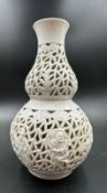 A Chinese pierced Blanc De Chine vase lamp base (H22cm)