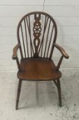 A wheel back Windsor chair