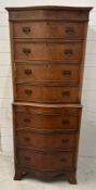 A Georgian style bow fronted chest on chest comprising of seven drawers (H155cm W63cm D41cm)