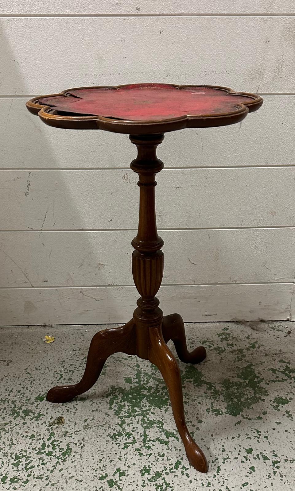 A red leather topped wine table Height 51cm AF