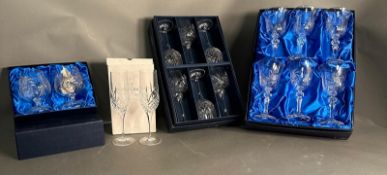 A selection of boxed crystal glasses by Royal Doulton and Bohemia to include wine glasses, champagne