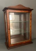 A mahogany table top display case with two glazed shelves and mirrored back. Height 54 37x19cm