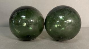 Two green glass fishing floats