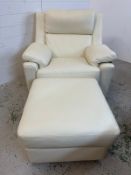 A contemporary white leather arm chair with matching footstool