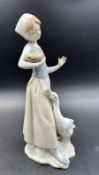 A Lladro figurine of a lady and goose