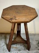 An Arts and Crafts table on tripod legs (H69cm W45cm)