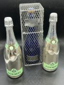 Two pommery display bottle and other in a cage box
