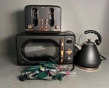 A selection of kitchen electrical goods and cutlery to include kettle microwave and a toaster by