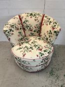 A vintage club chair with floral upholstery