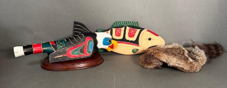 A selection of native Canadian items to include a raven afterlife rattle, wooden salmon and a childs