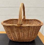 A wicker fruit pickers basket