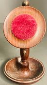 A wooden pocket watch stand by Mike Fitz
