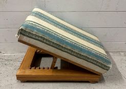 A pine folding footstool upholstered in white and blue