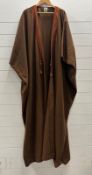A brown West African Kaftan with embroidered cuffs and edging