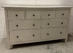 A large white sideboard comprising of four short drawers over four long (H95cm W162cm D51cm)
