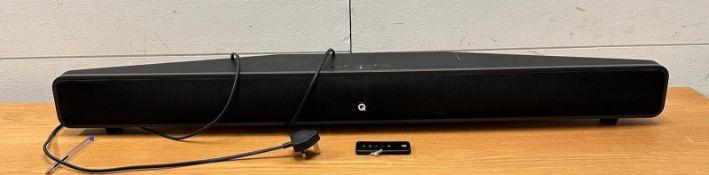 A Q acoustics sound bar with remote