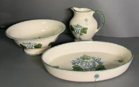 Three pieces of Poole Pottery to include bowl, jug and dish