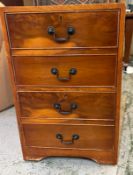 A two drawer filing cabinet in yew with brass drop down handles