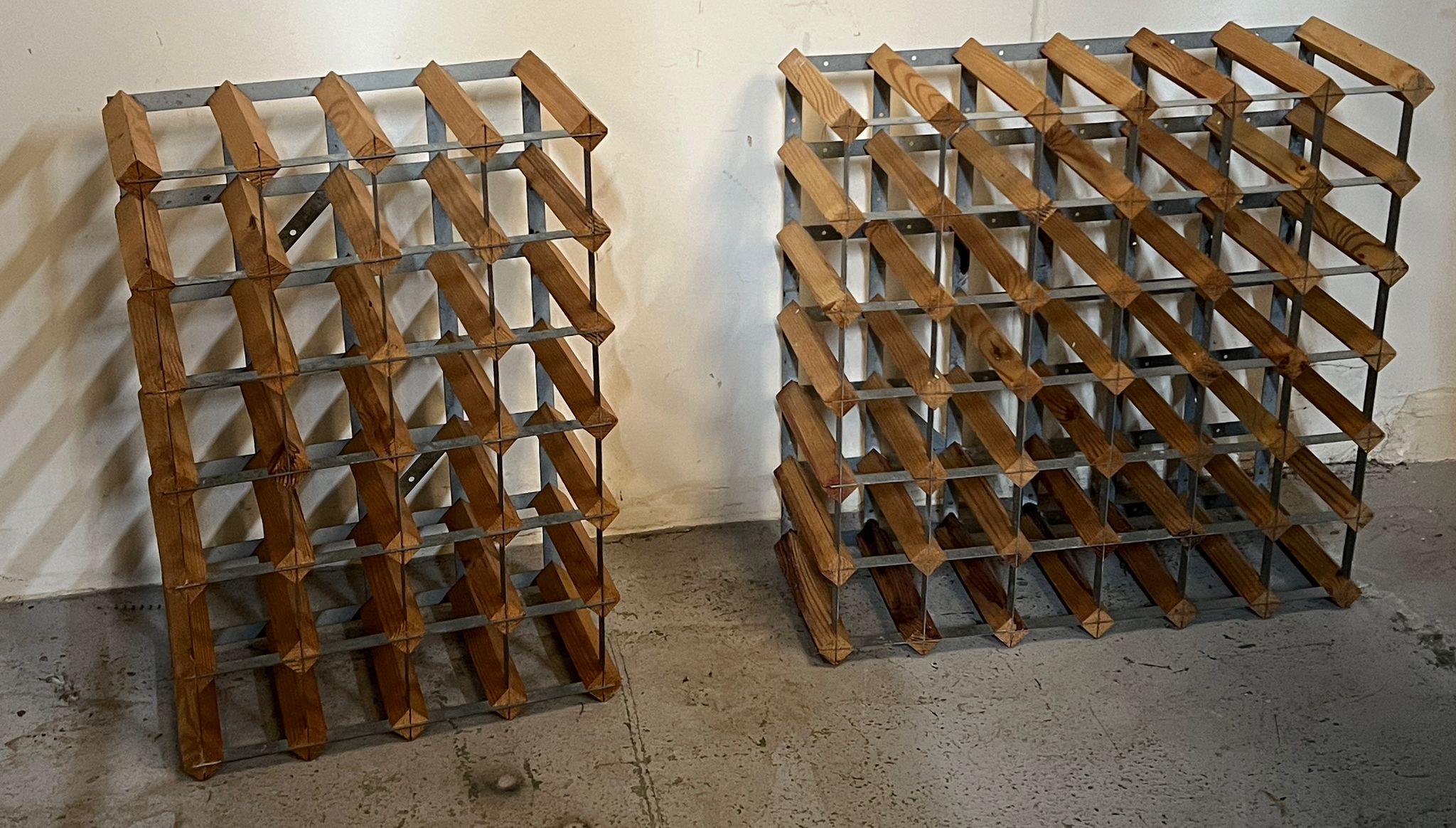 Two wooden bottle racks