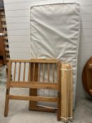 A single truckle bed, pine frame and lower bed under