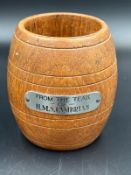 A pen pot in the style of a barrel from the teak of H M S Cambrian