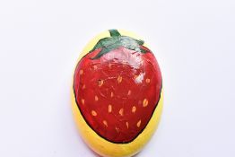 A Pebble hand painted by TV presenter and cook book author Chris Bavin to raise funds for the