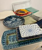 A selection of various plates mostly rectangles and square