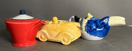 Three ceramic tea pots of a bird, car and a sadler, Art Deco style