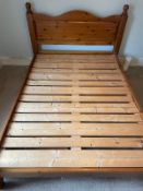 A pine 4.6ft double bed frame