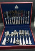 A boxed silverplate six place Judge cutlery set