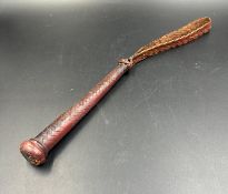 A vintage woven leather fisherman's priest