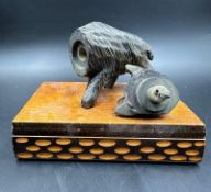 A black forest wooden novelty smoking companion of a wild boar lighter on plinth