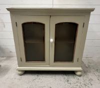 A glazed painted side cabinet on bun feet AF (H76cm W80cm D25cm)