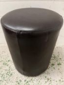 A small faux leather footstool (H43cm Dia 35cm)