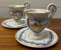 Two French cups and saucers