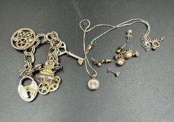 A small selection of costume jewellery including some 9ct gold earrings.