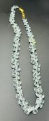 An aquamarine necklace with an 18ct gold clasp.