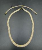 An Italian silver triple tone wave necklace and a bracelet marked 925
