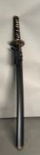 A Wakazachi black wood Japanese sword