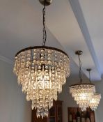 A set of three waterfall chandeliers, three tier of cut glass spearhead drops