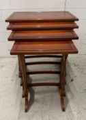 A nest of four side tables on splayed legs and turned spindle supports by Bradley (H60cm W58cm