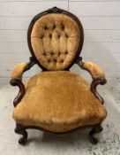 A Victorian walnut button back ladies chair n a brown velvet upholstery