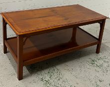 A hardwood Bradley two tier coffee table (H55cm W123cm D62cm)