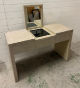 A contemporary faux studded grey leather dressing table with hinged folding mirror