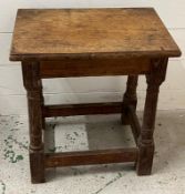 A square oak stool on turned legs with cross stretchers (H46cm W53cm D30cm)