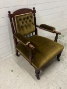 A Victorian upholstered elbow chair