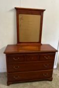 A mahogany veneer sideboard with a bevel edged mirror over and multiple long and short drawer