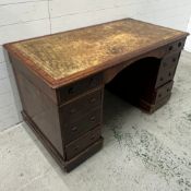 A mahogany pedestal desk with leather top (H74cm W133cm D70cm)