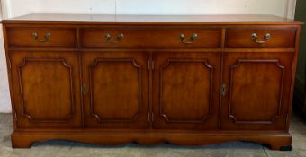 A mahogany veneer sideboard comprising of a cutlery drawer and two others over two, two door